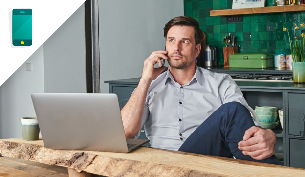 Man sitting behind laptop 